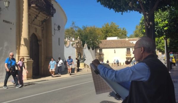 El artista pintando la plaza de toros de la Real Maestranza de Caballería